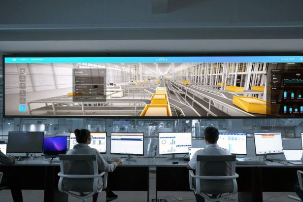 Pessoas monitoram telas digitais e sistemas de computador em uma moderna central de operações.