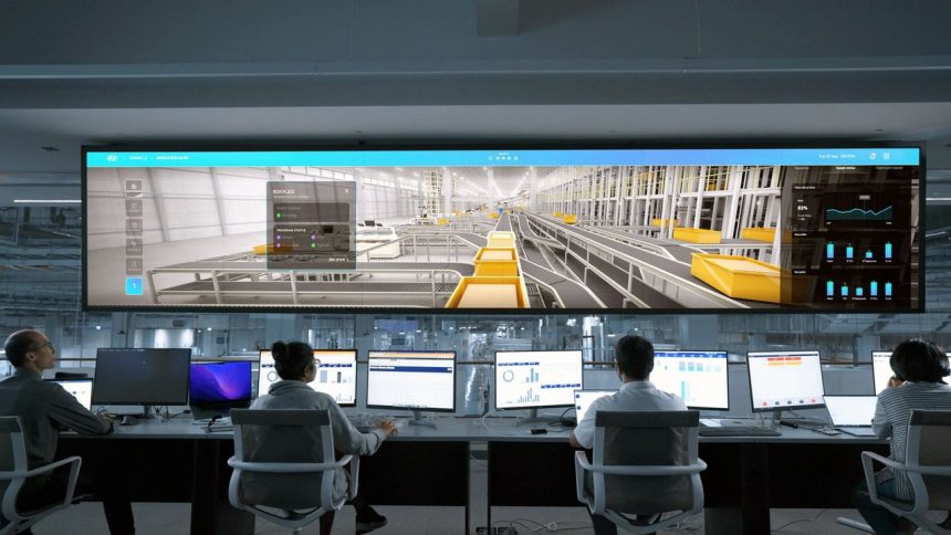 Pessoas monitoram telas digitais e sistemas de computador em uma moderna central de operações.